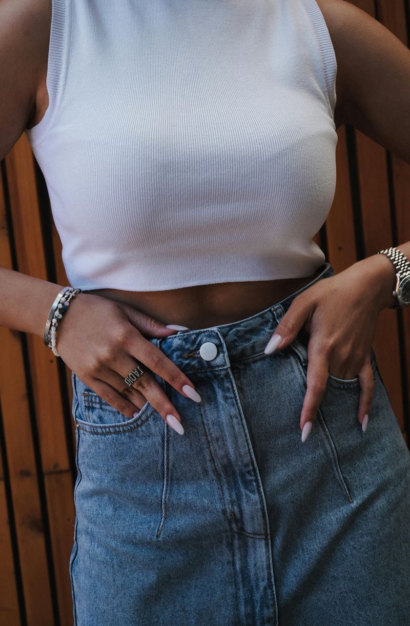 Wear a Cropped Top or Bralette with High-Waisted Jeans