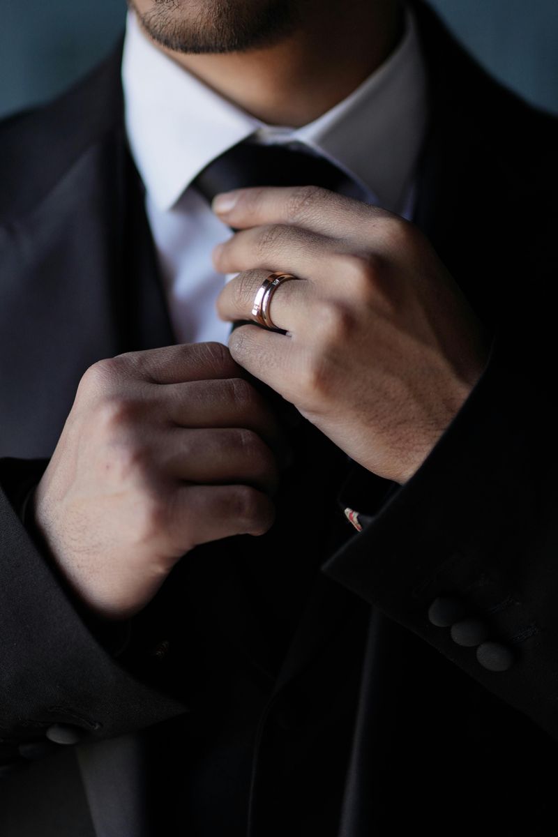 Adjusting His Tie or Collar