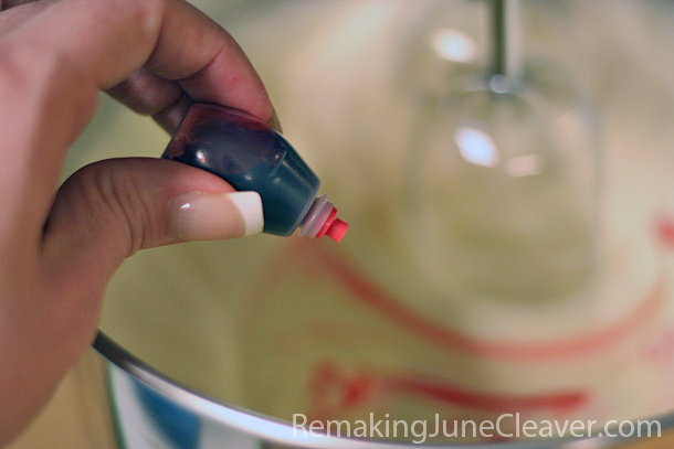 Adding red food coloring into batter 