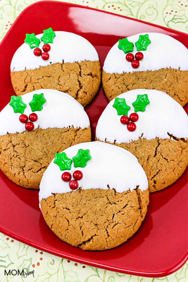 a red plate with Gingerbread Holly Cookies