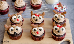 Chocolate cupcakes with reindeer decorations and cinnamon cream cheese frosting