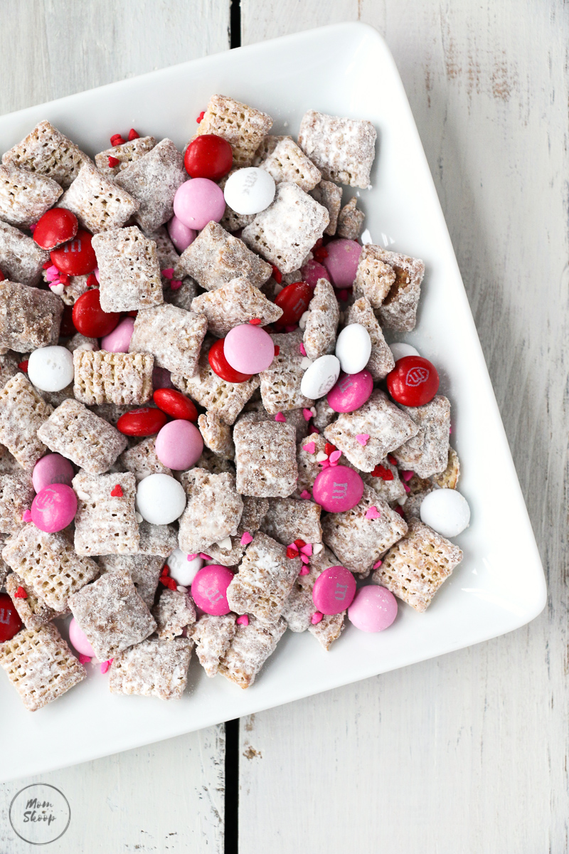 Valentines Day Puppy Chow full of red, pink, and white M&Ms and sprinkles