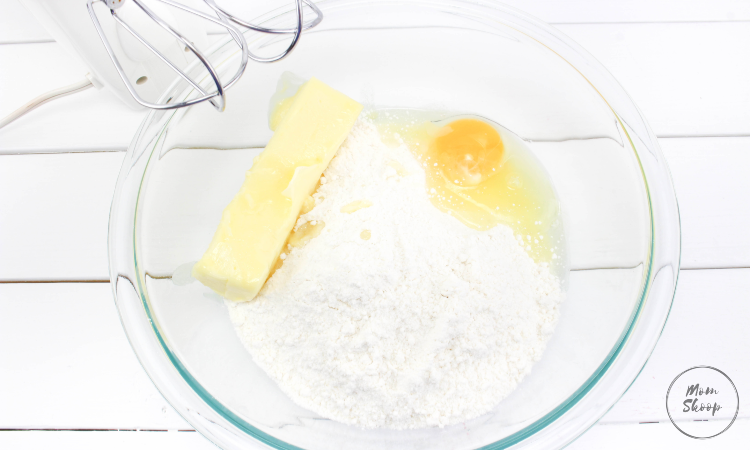 Mixing cake mix, egg, and butter together. 