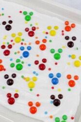 White chocolate bark with M&Ms in the shape of Mickey Mouse