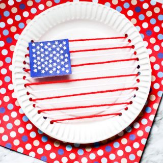 American Flag made out of paper plate and yarn