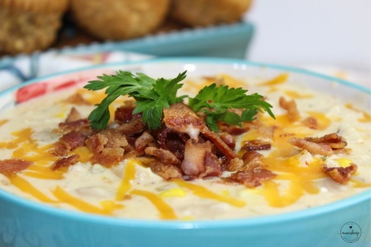 Small bowl of White Chicken Chili with cheese and bacon