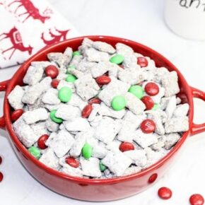 Christmas Puppy Chow with Red and Green M & Ms and in a red bowl