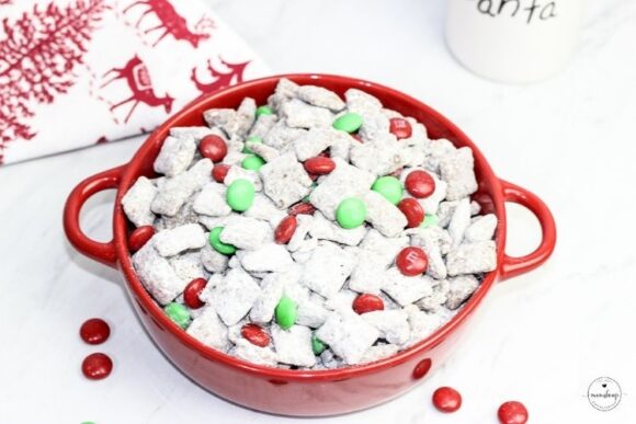 Christmas Puppy Chow with Red and Green M & Ms and in a red bowl