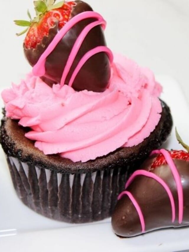 Chocolate cupcake topped with a chocolate covered strawberry
