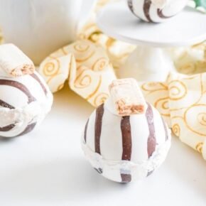 Hot chocolate bombs with peanut butter candy on top using white chocolate melts