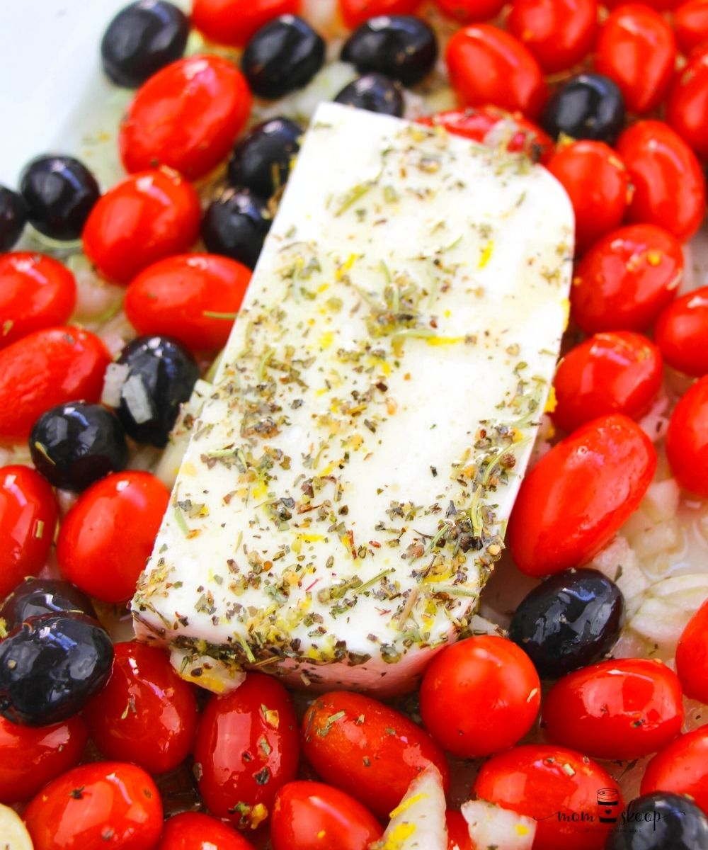 Tomatoes, Black Olives, Feta Cheese, and seasoning in a baking dish