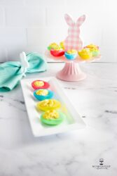 Easter Deviled Eggs on a white tray
