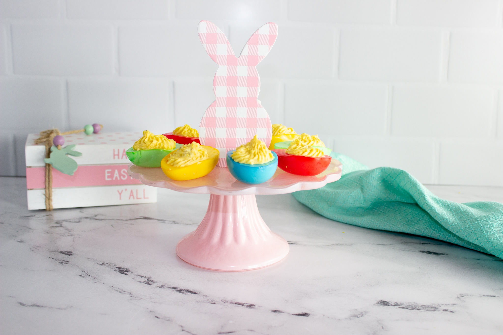 Pink cake stand with Easter Colored Deviled Eggs