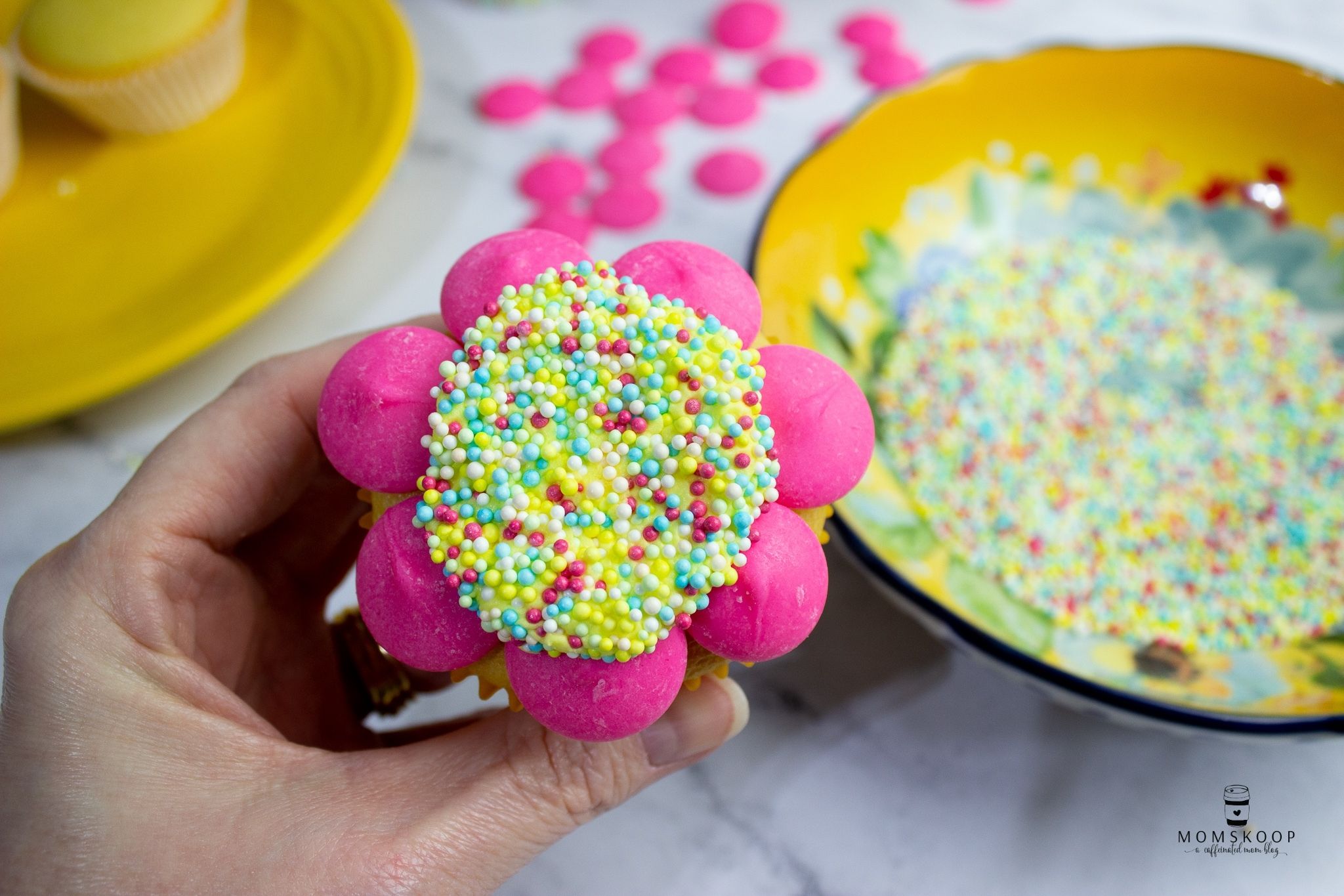 Spring cupcake with sprinkles and pink candy melts