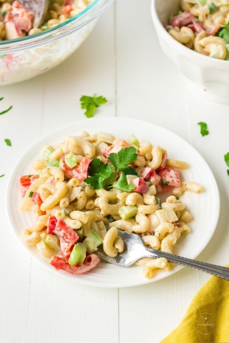 Macaroni salad on a white plate.