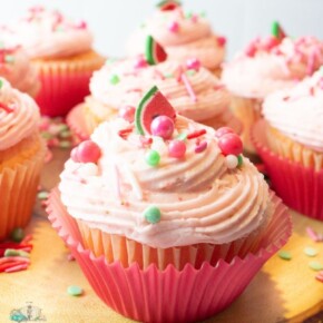 Strawberry Cupcakes with Watermelon Flavoring Oil on a wood plank