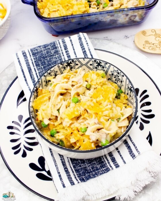Tuna Noodle Casserole in a white and blue bowl on a white plate with blue designs