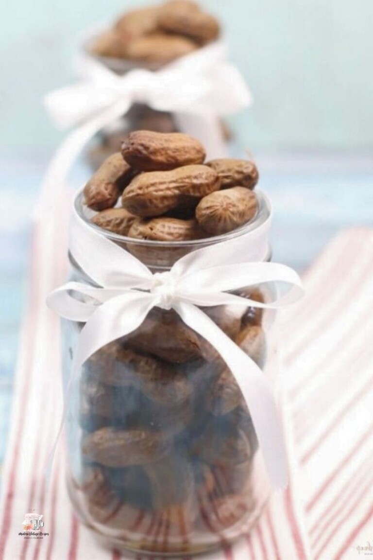 Southern-style boiled peanuts in a glass jar with a white ribbon around it