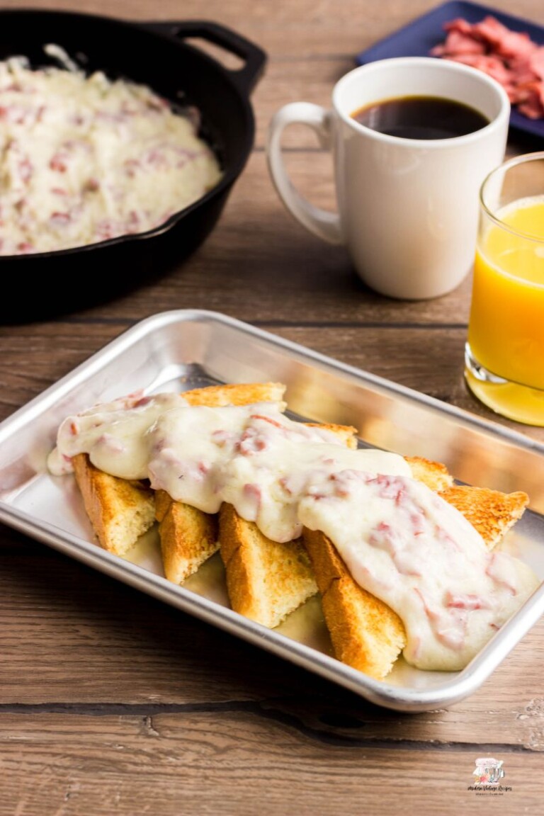 Chipped beef on toast in a stainless steel pan.