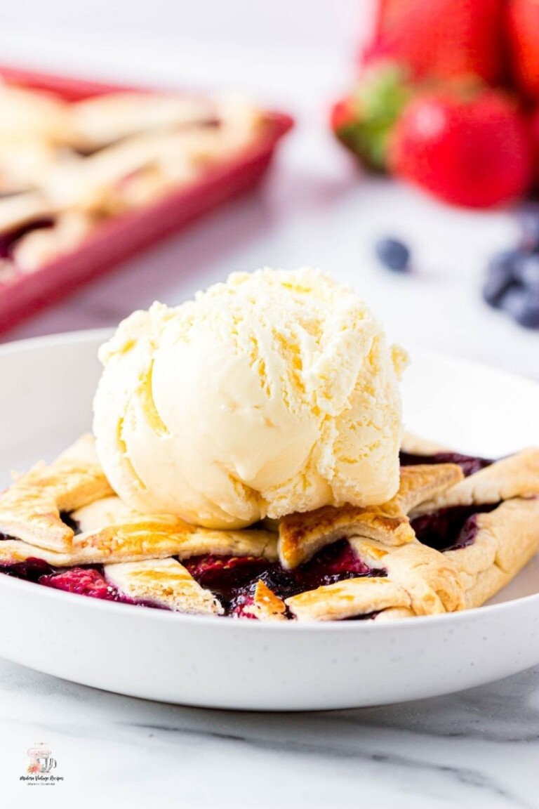 Slab pie with a dollop of ice cream on a white plate