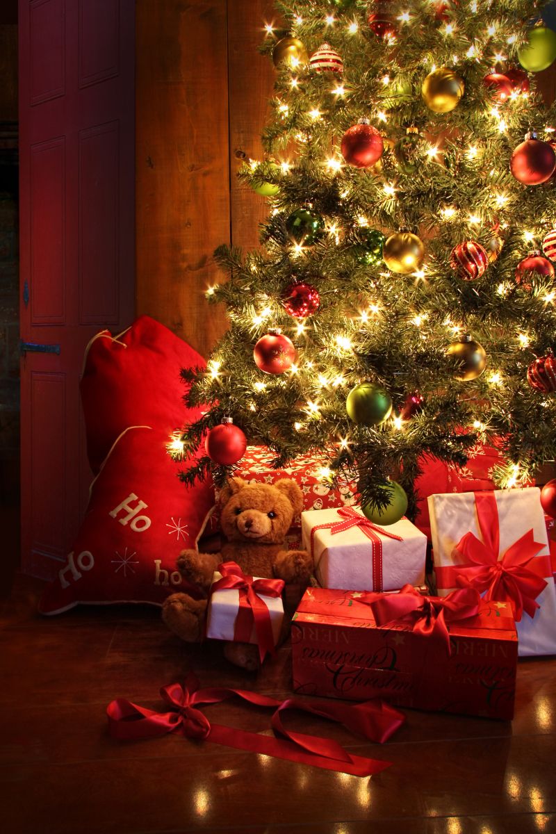 Christmas tree with presents and white lights