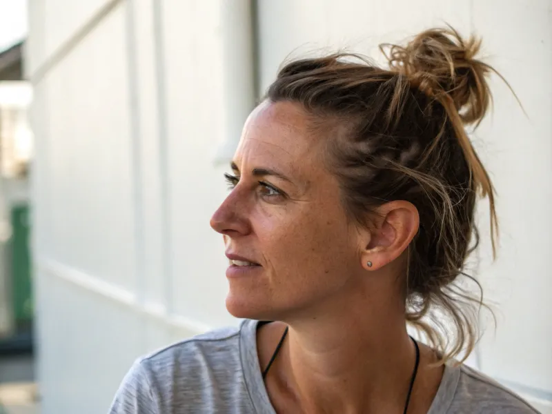 Messy Top Knot with Face-Framing Pieces