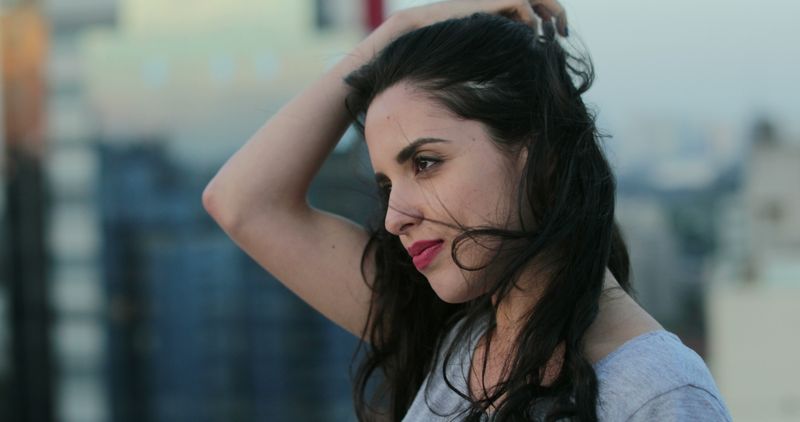 Playing With Her Hair While Deep in Thought