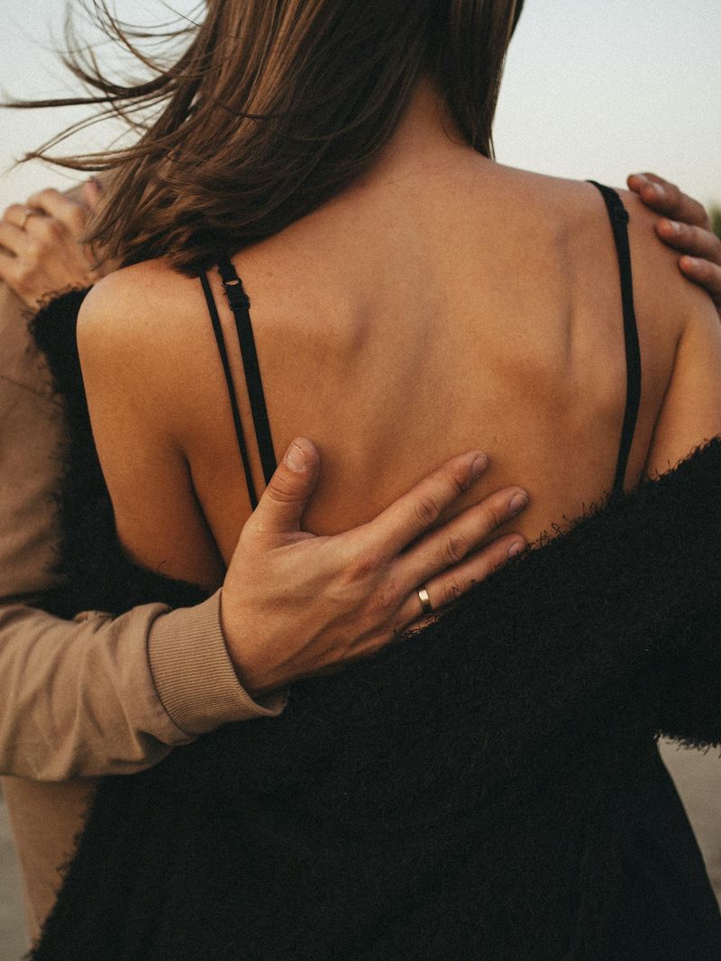 Placing His Hand on Her Lower Back