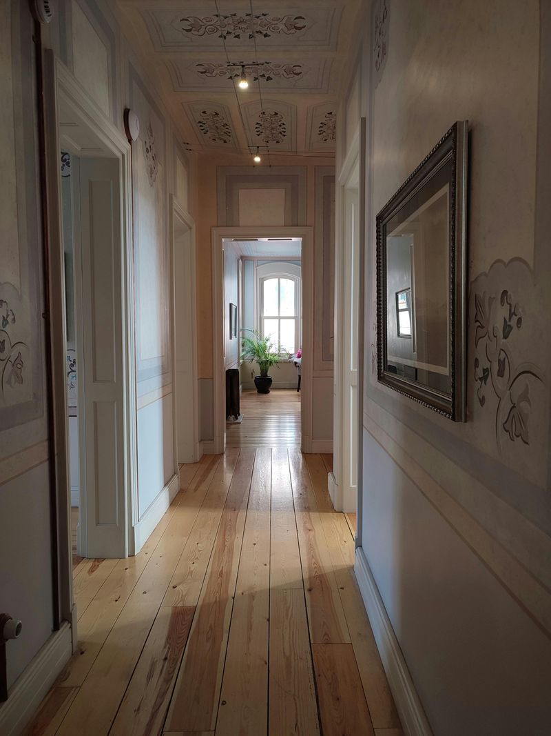 The Faint Creak in the Hallway Floor