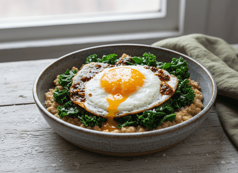 Savory Oatmeal with Fried Egg, Sauteed Greens, and Chili Oil
