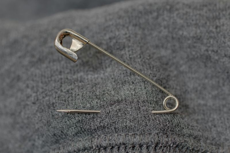 A Safety Pin, Spare Button, or Tiny Sewing Kit (Because You Never Know)