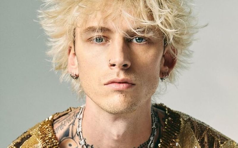 Machine Gun Kelly – Bold Blackwork from Neck to Wrist