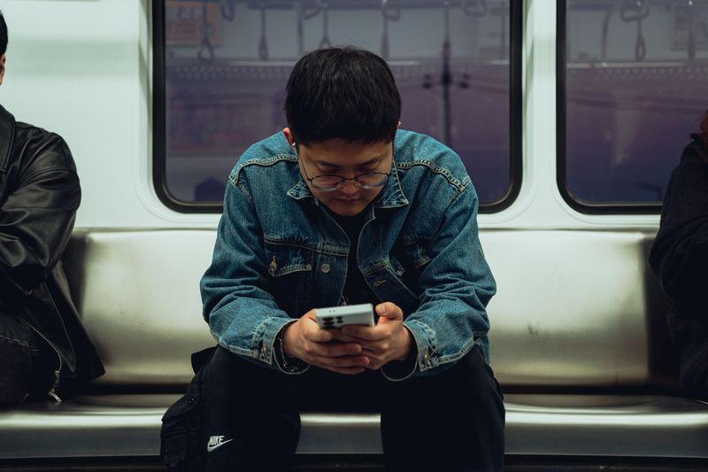 Staying Glued to a Phone Instead of Noticing People Around You