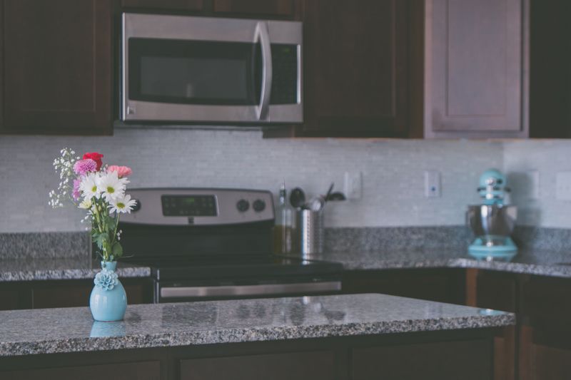 A Kitchen Island That Has Become a Catchall for Everyday Clutter