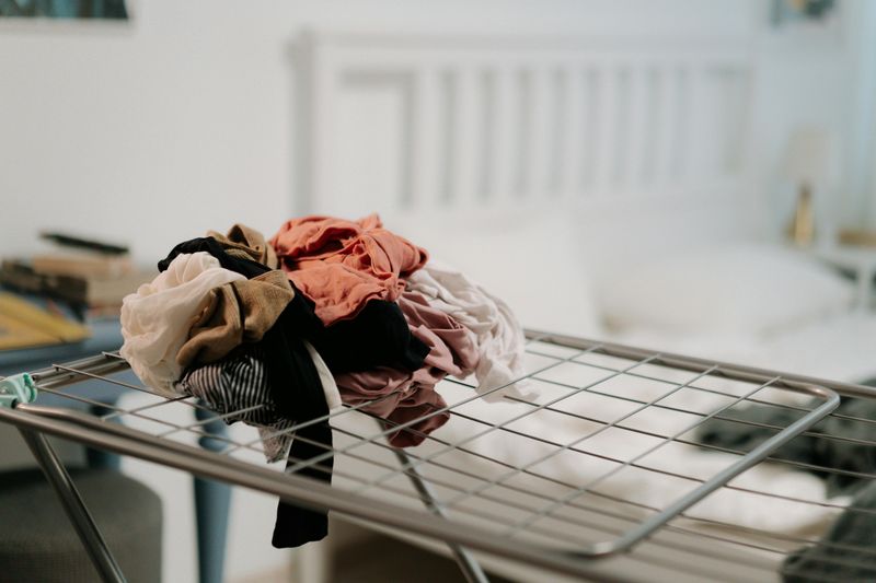 Piles of Unfolded Laundry on Furniture