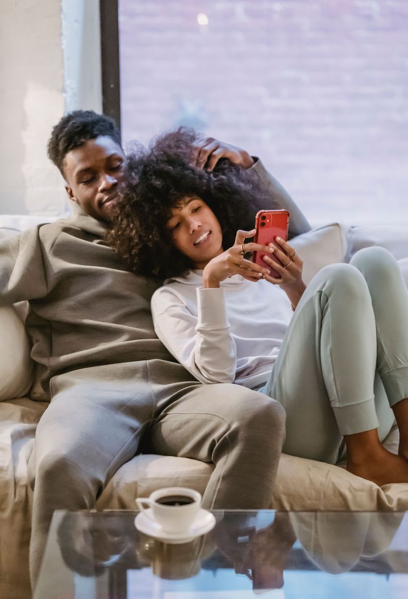 Sitting together while both scrolling on your phones