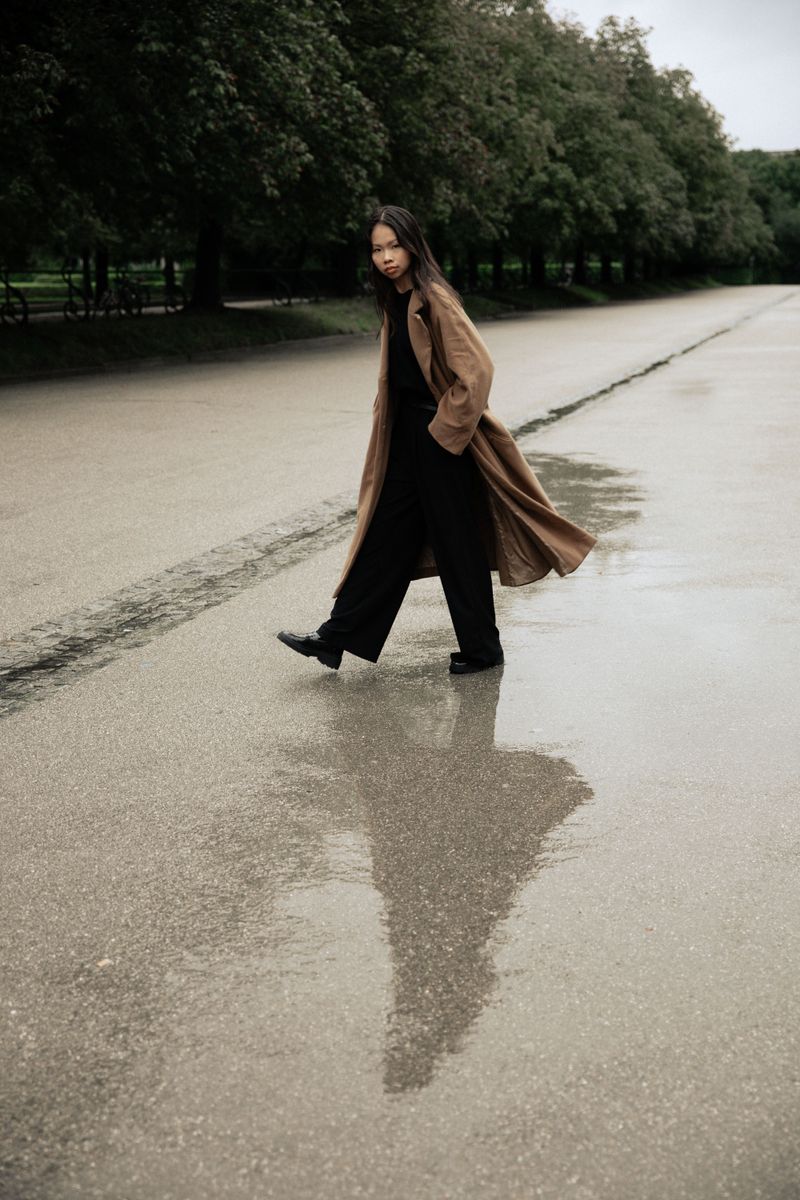 Floor-Length Trousers on Wet Pavement
